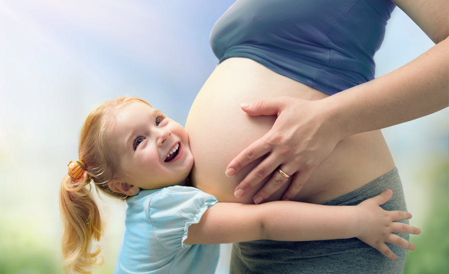 Pregnant mom with her daughter