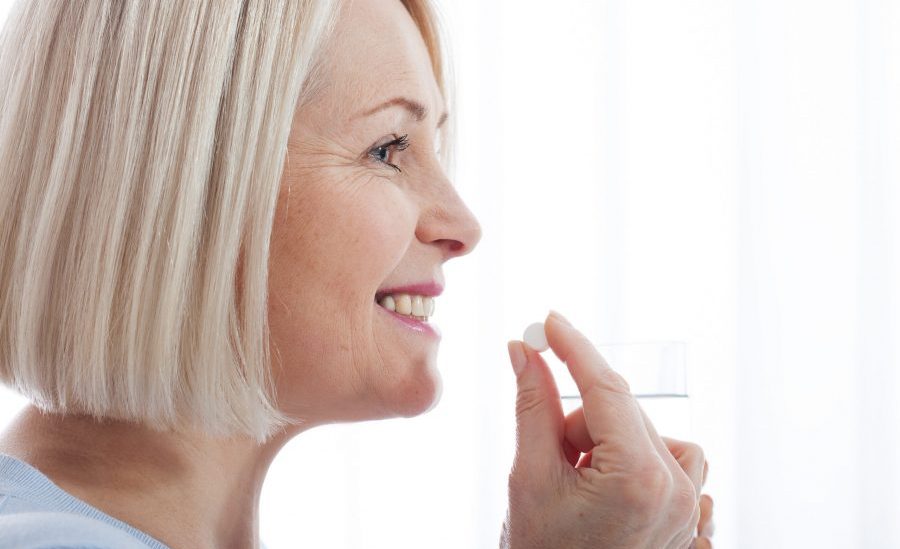 Woman taking antibiotic